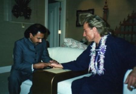 Professor Sasi reading the palm of famed Illusionist Siegfried